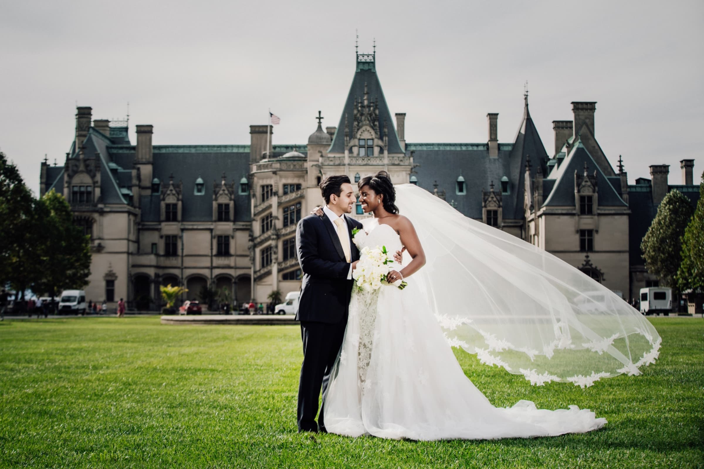 Cathedral veil catching the wind on the lawn in front of Biltmore House — Biltmore Estate