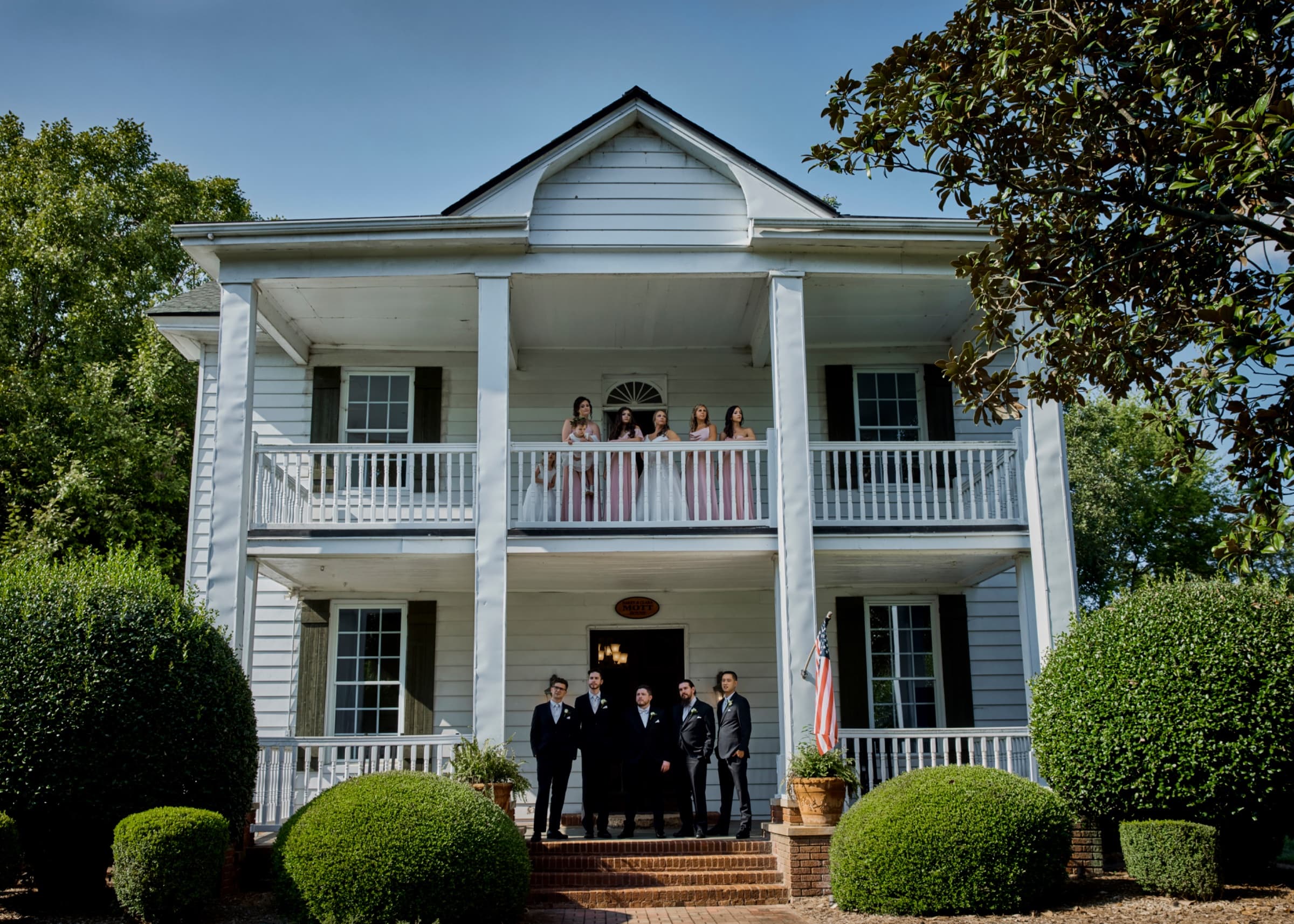 Wedding party on the double porch of the plantation house — Langtree Plantation wedding venue, Mooresville, North Carolina