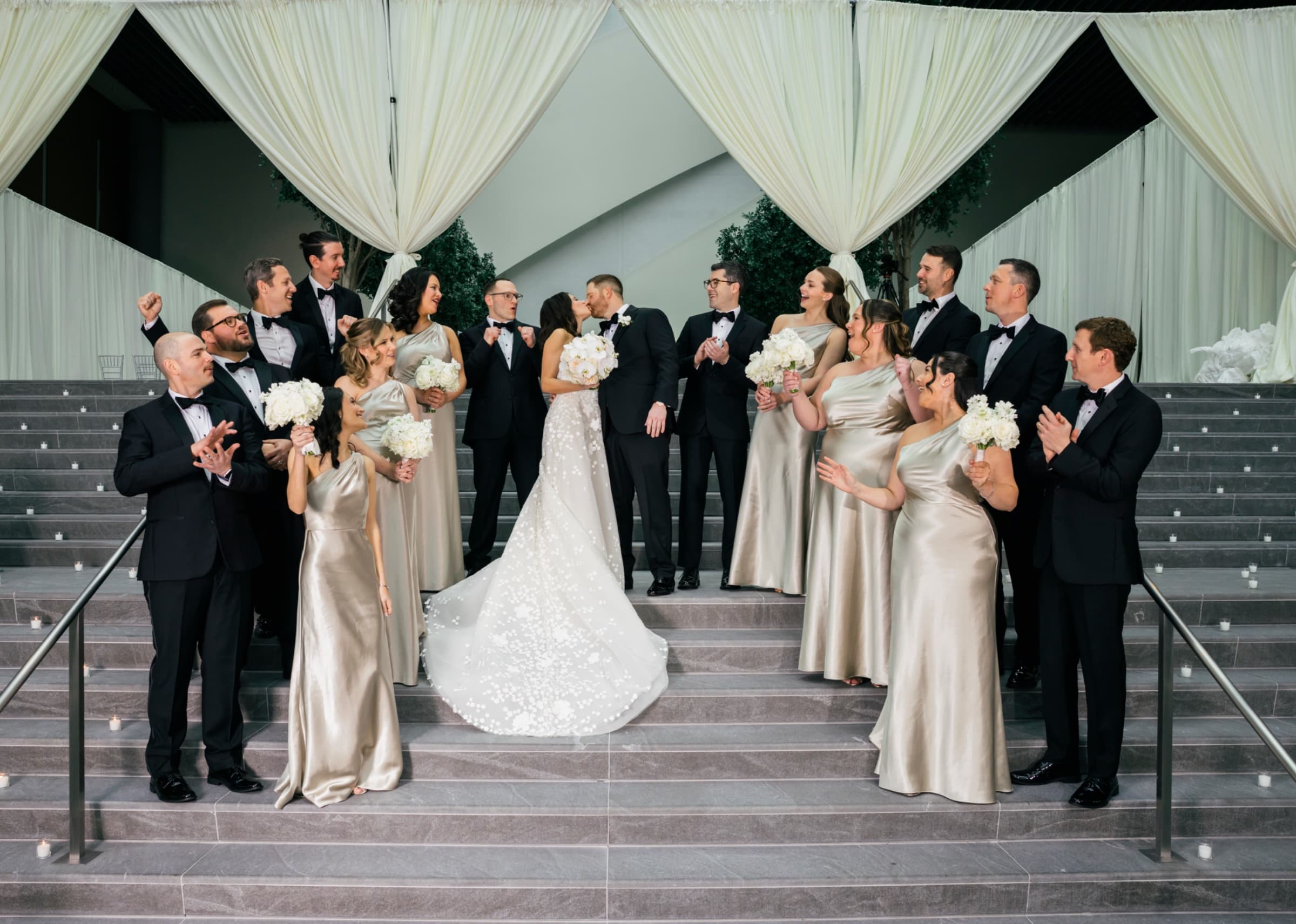 Wedding party on the staircase in champagne satin beneath draped ivory fabric — The Ritz-Carlton Charlotte