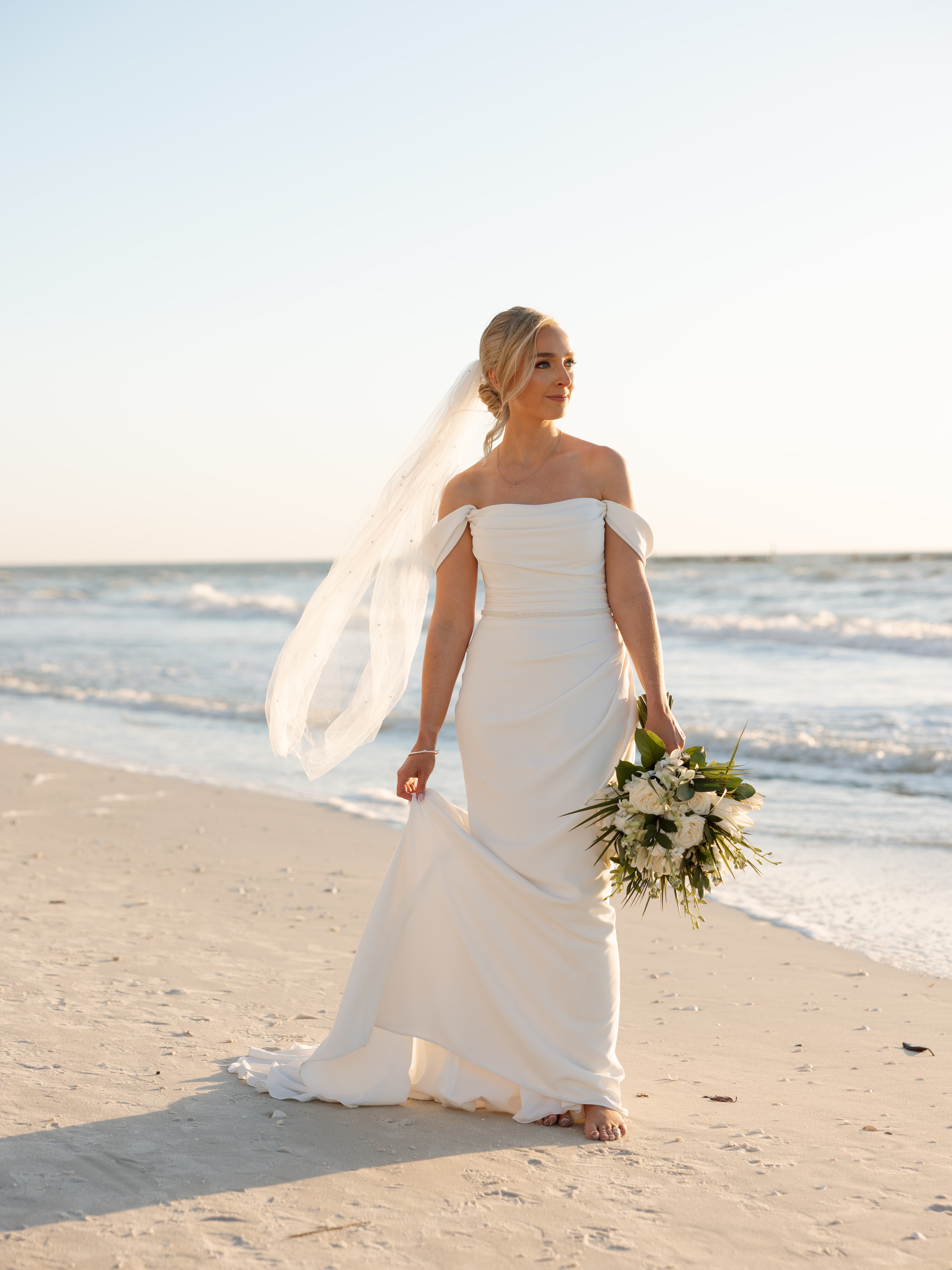 Bride on the beach during sunset
