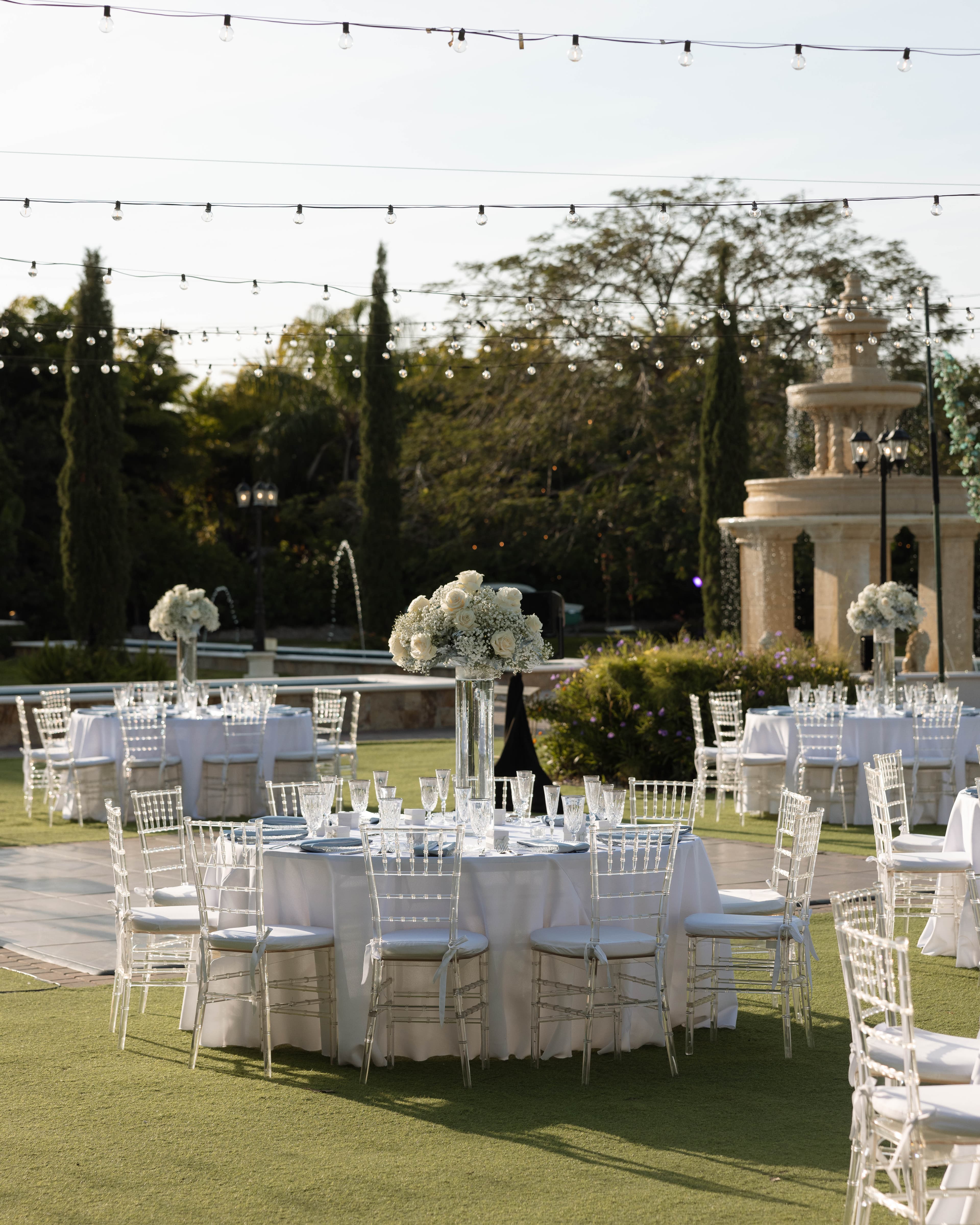 Outdoor reception with string lights and chiavari chairs — Villa Toscana Miami wedding venue, Homestead, Florida