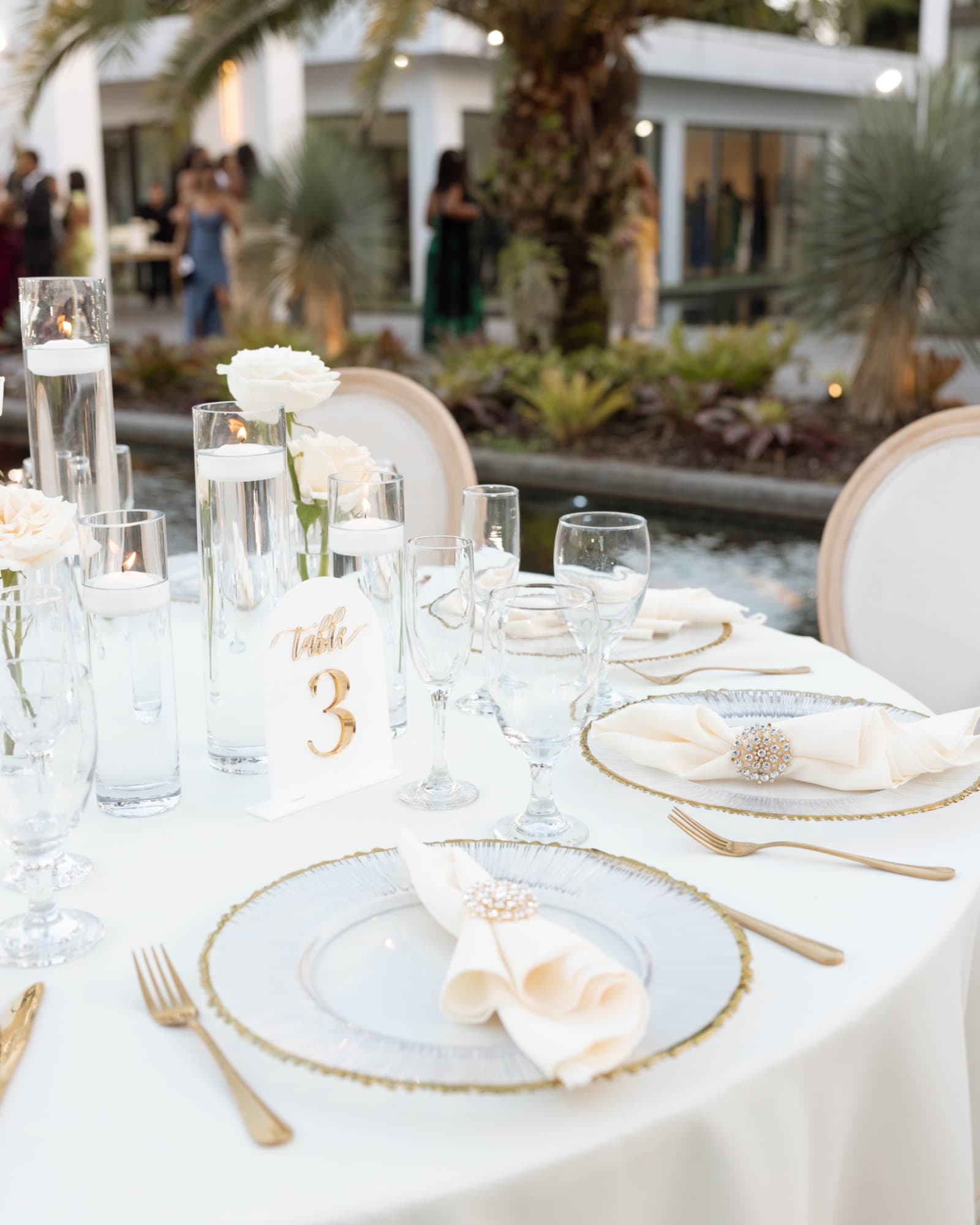 A tablescape at table three, gold and white — The Glass Venue wedding venue, Miami, Florida