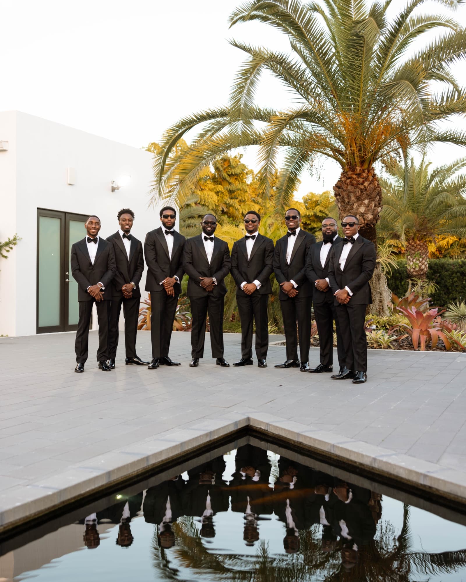 The groomsmen along the reflecting pool at The Glass Venue — The Glass Venue wedding venue, Miami, Florida
