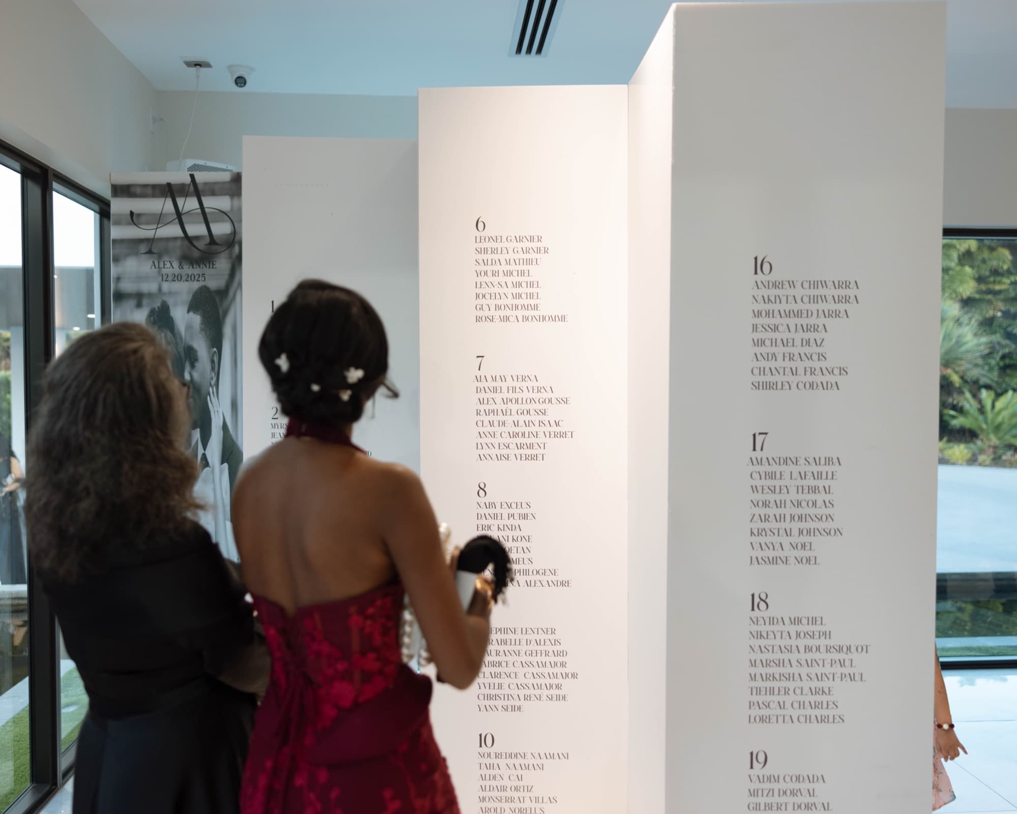 Guests finding their names on the seating chart — The Glass Venue wedding venue, Miami, Florida