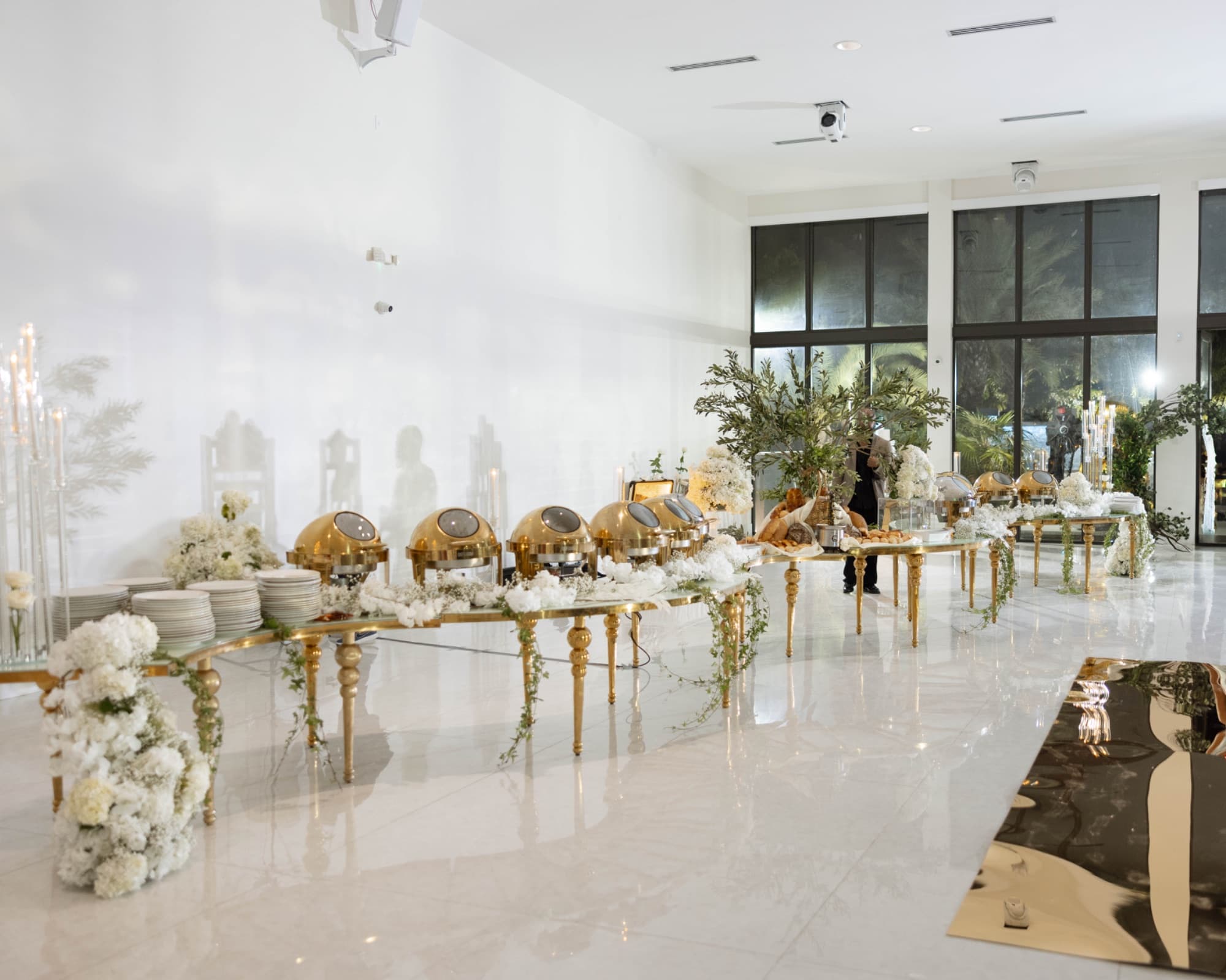 The reception room set in white and gold before the doors open — The Glass Venue wedding venue, Miami, Florida